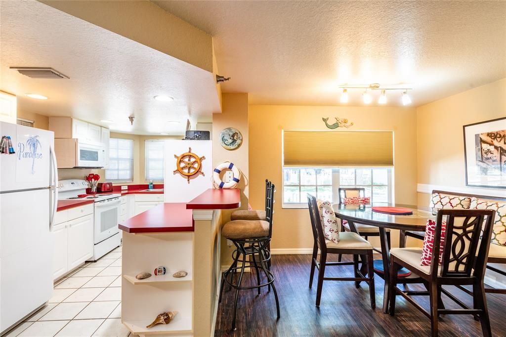 The kitchen is convenient to the dining area and the breakfast bar seats 2.