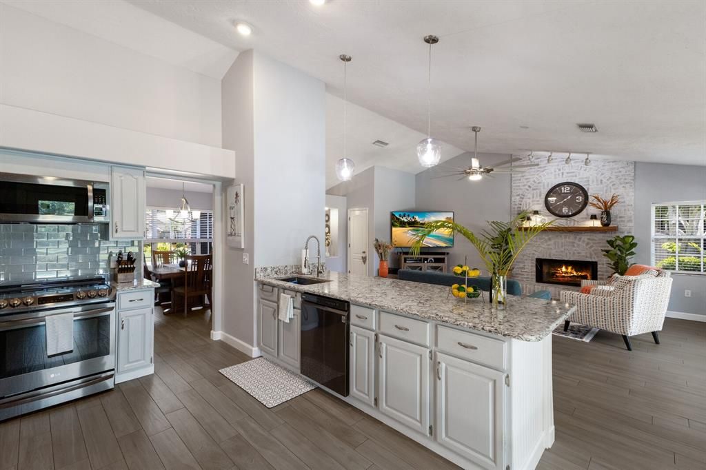 Gorgeous quartz countertops and glass backsplash