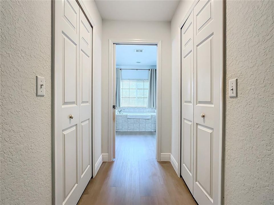 Hall to walk-in closets and en-suite primary bathroom