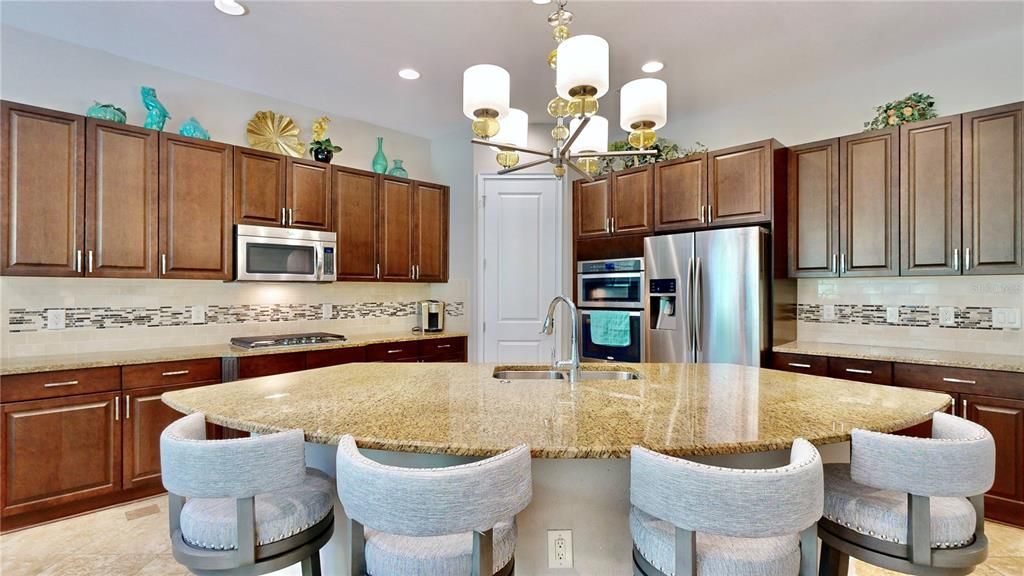 Custom kitchen with a plethora of counterspace and cabinets