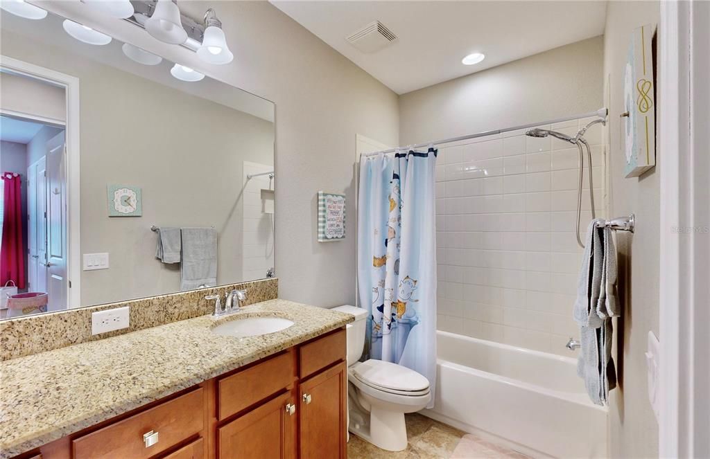 Bathroom shared by secondary bedrooms