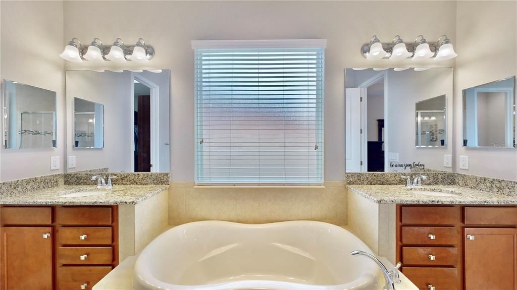 Full view of double sinks with granite countertops