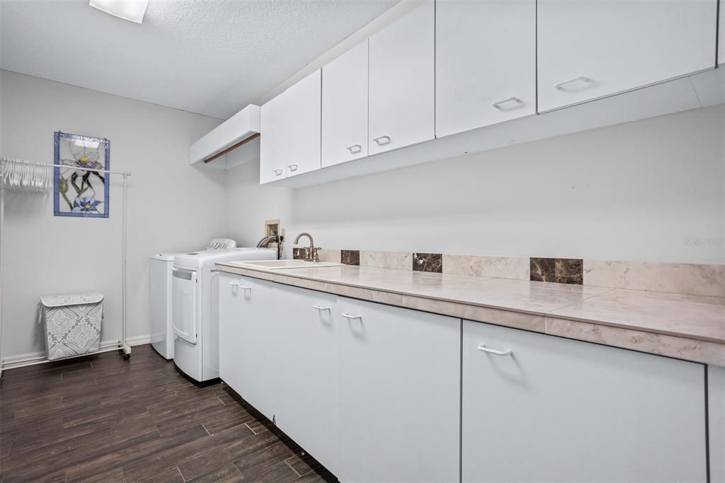 Indoor Laundry room with expanded countertop and cabinetry