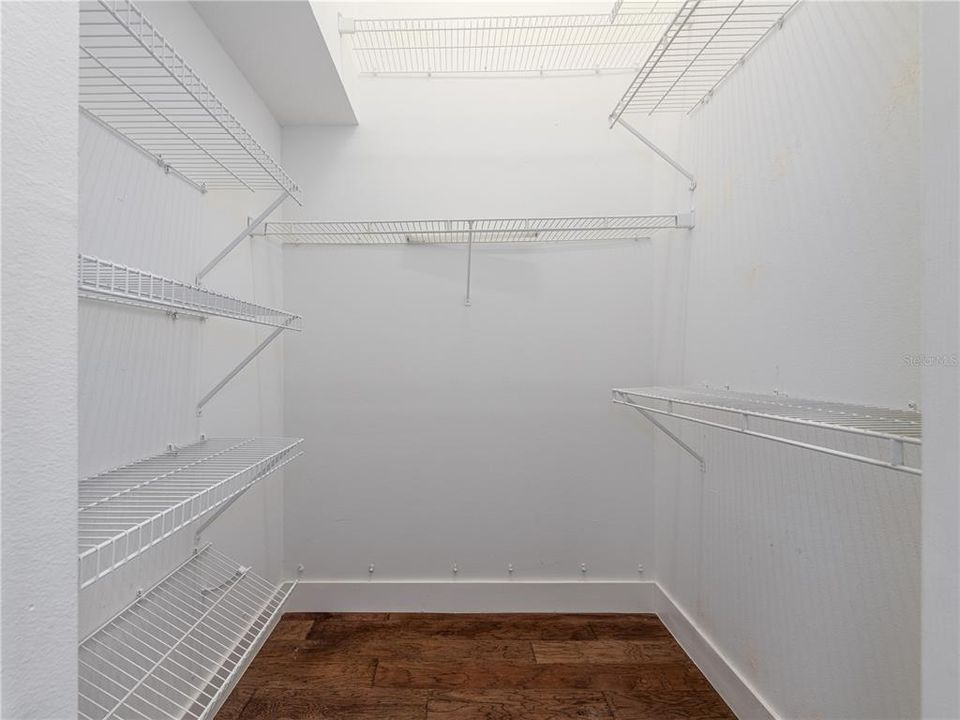 Primary bedroom walk-in closet #1