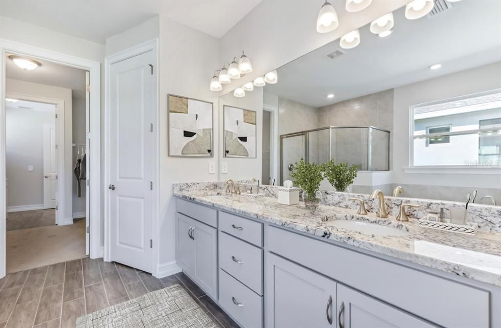 MASTER BATH SUITE  His and Her sinks with Granite CountertopsStaged Photo from Model Home