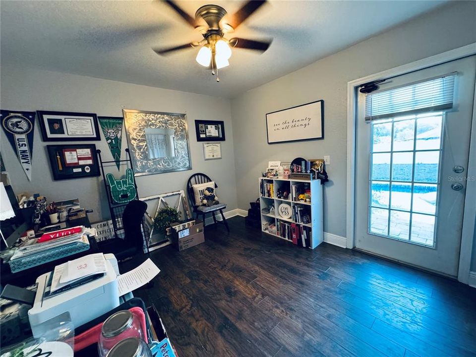 4th bedroom w/ exterior door exiting to pool and deck space