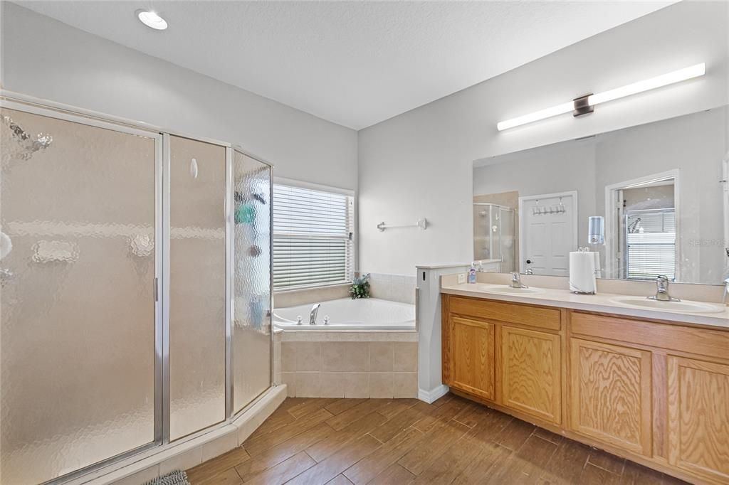 Primary En-suite Bathroom with Walk-In Shower, Soaking Tub, Double Vanity and Walk-In Closet