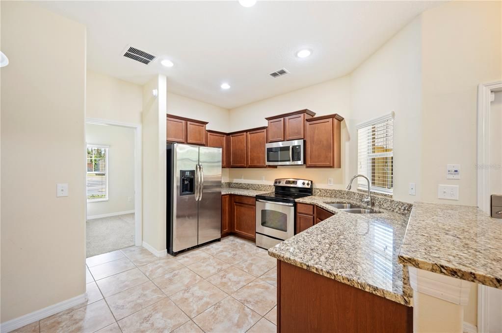 Kitchen with granite counters and stainless steel appliances