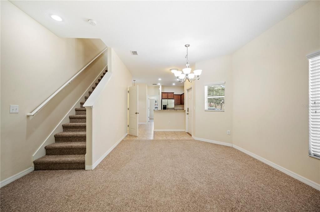 Great Room looking over to front entry and Kitchen