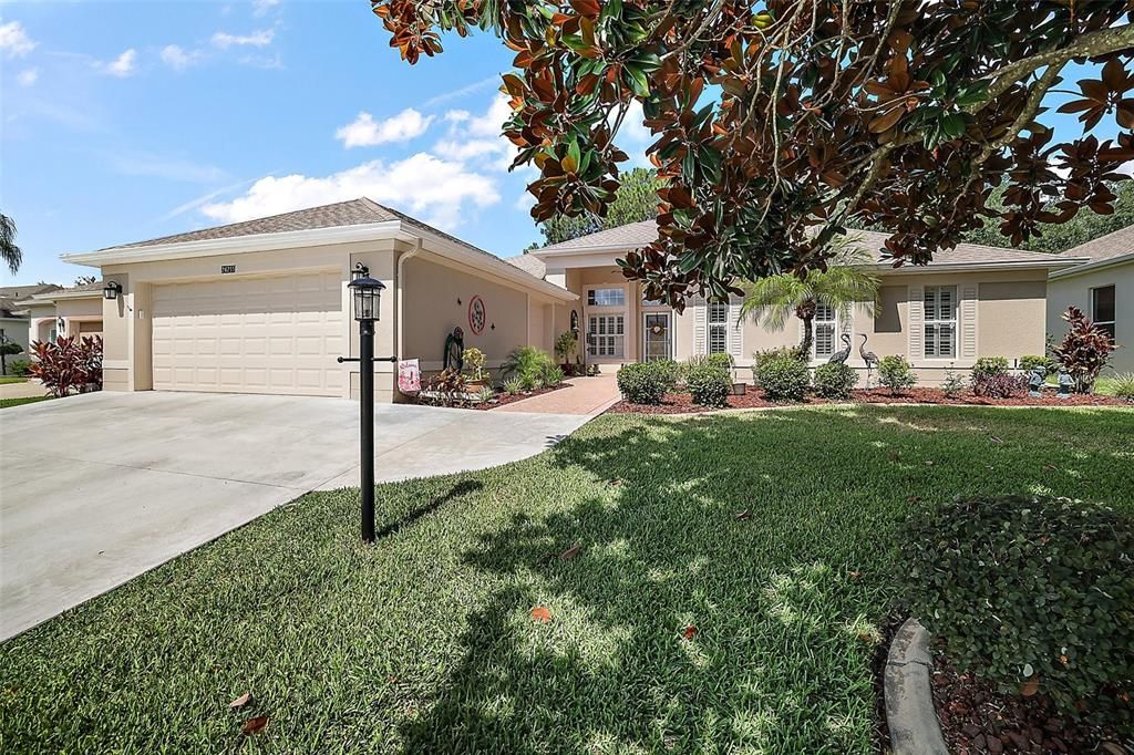 This home has a large 2 car garage and a side golf cart garage.