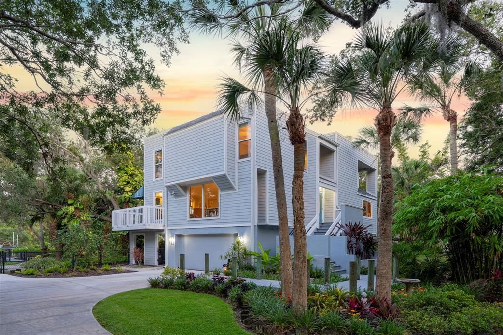Welcome to 2385 Fiesta Drive, a serene and private oasis nestled on the peaceful boating waters of Phillippi Creek in Sarasota, FL.