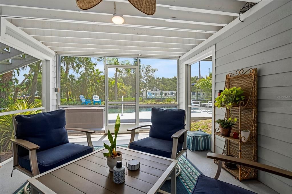 The covered, screened in Lanai provides shade and inviting views.