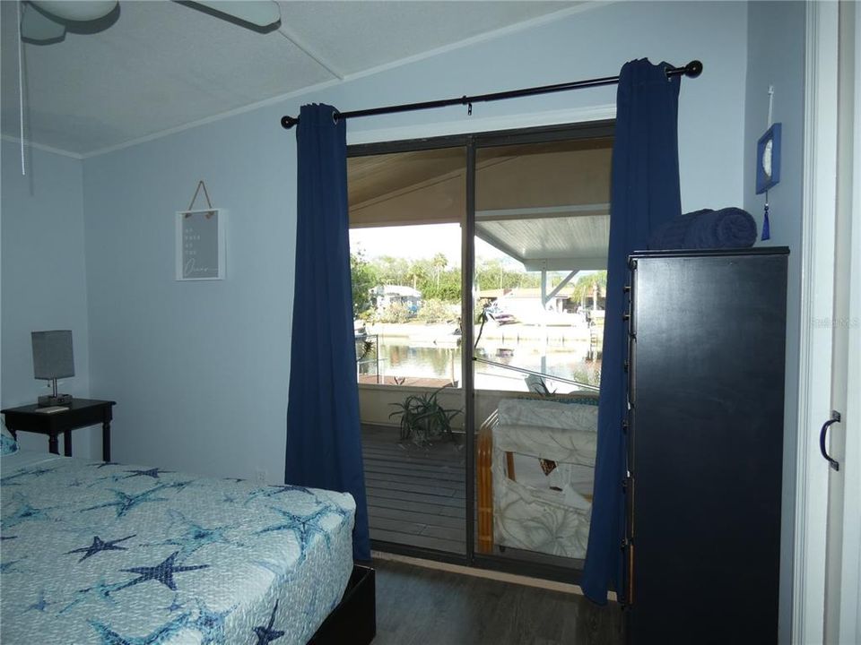 Guest bedroom waterfront view. The 2 bedrooms are split plan and both have attached bathrooms.