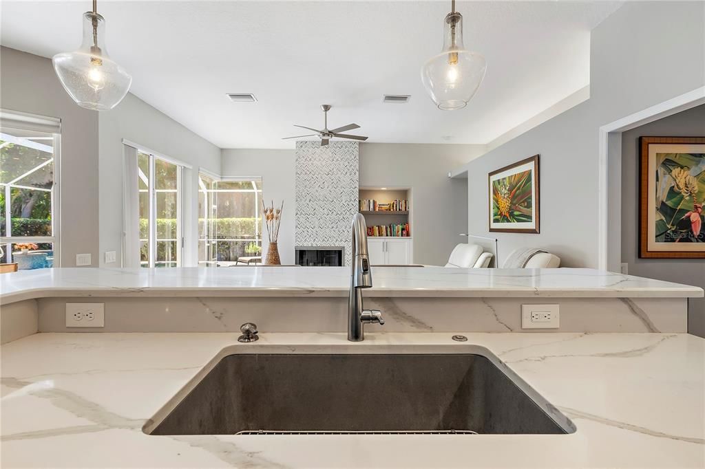 Beautiful quartz and tile backsplash. Gas cooktop, electric oven