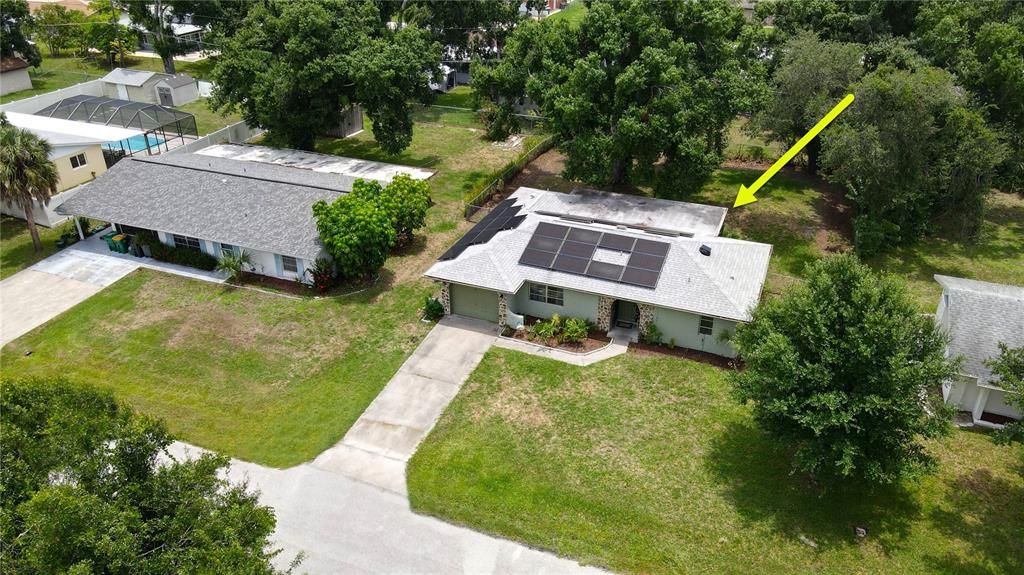 Aerial view of home showing new solar electric system