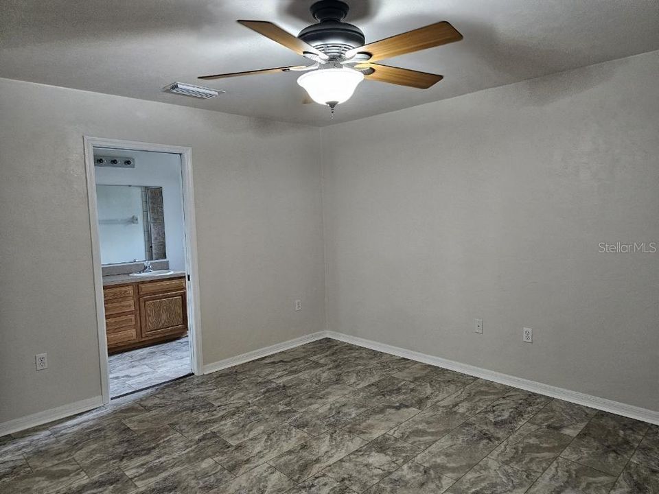 master bedroom with door to great room