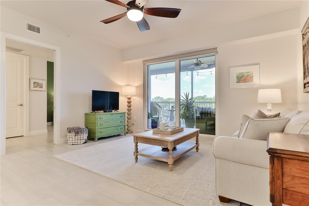 Living Room opens up to screened balcony