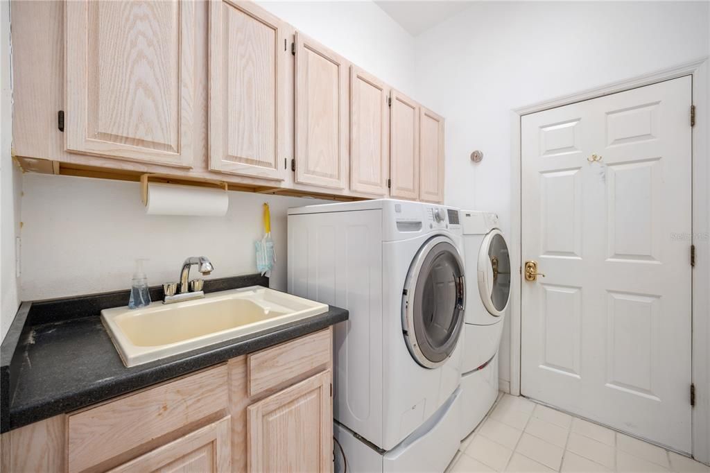 Interior laundry room with utility sink