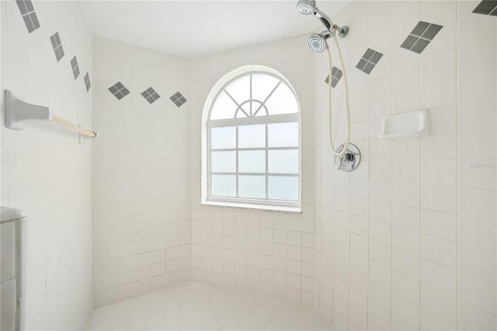 Walk in shower with decorative tile