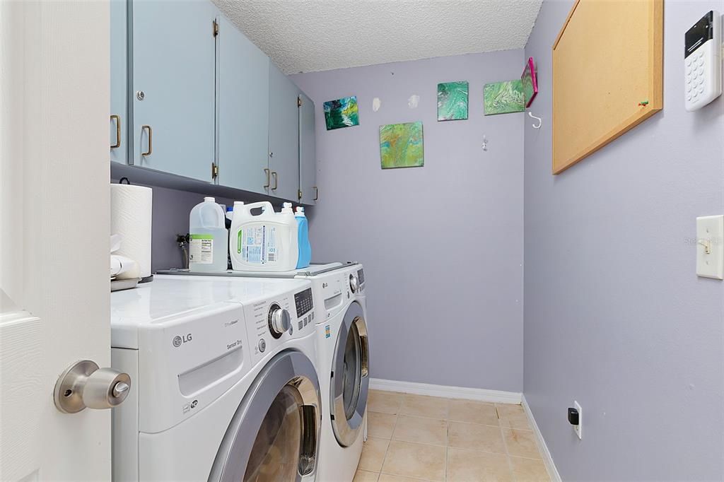 laundry with washer dryer and tub