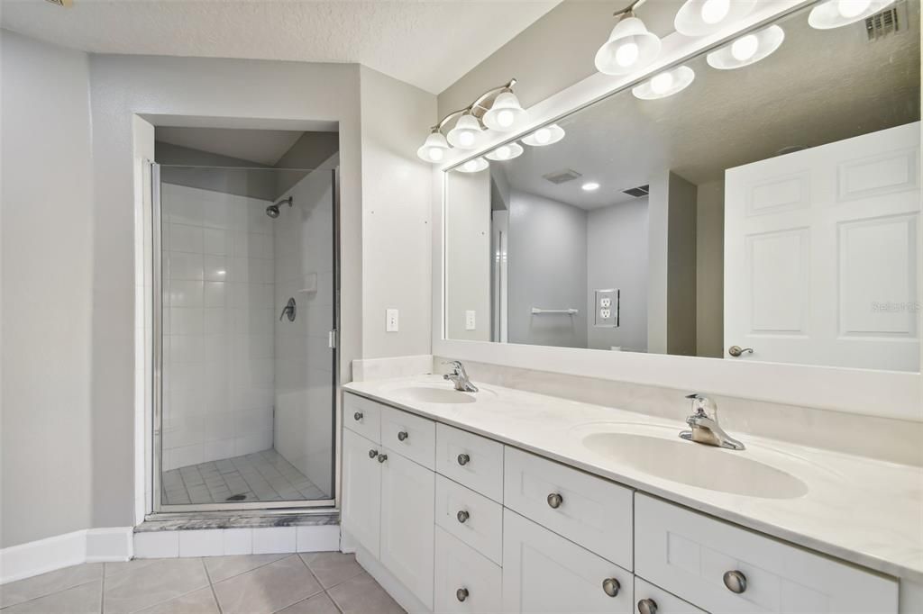 Dual sinks and walk in shower.