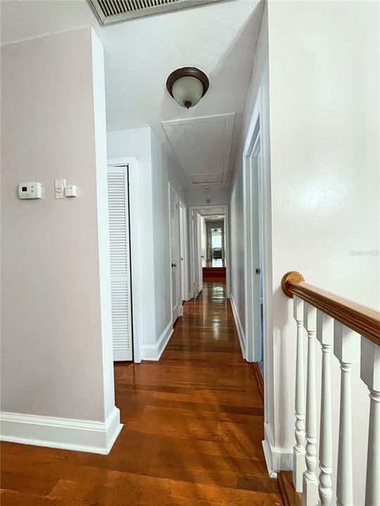 Hallway to all upstairs bedrooms each with private bath