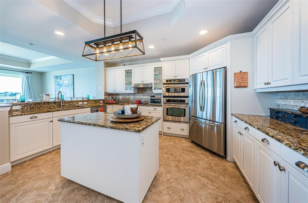 Kitchen Prep Isle in Middle for Easy Access and Extra Cabinet Space..