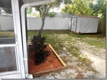 FENCED YARD WITH SHED