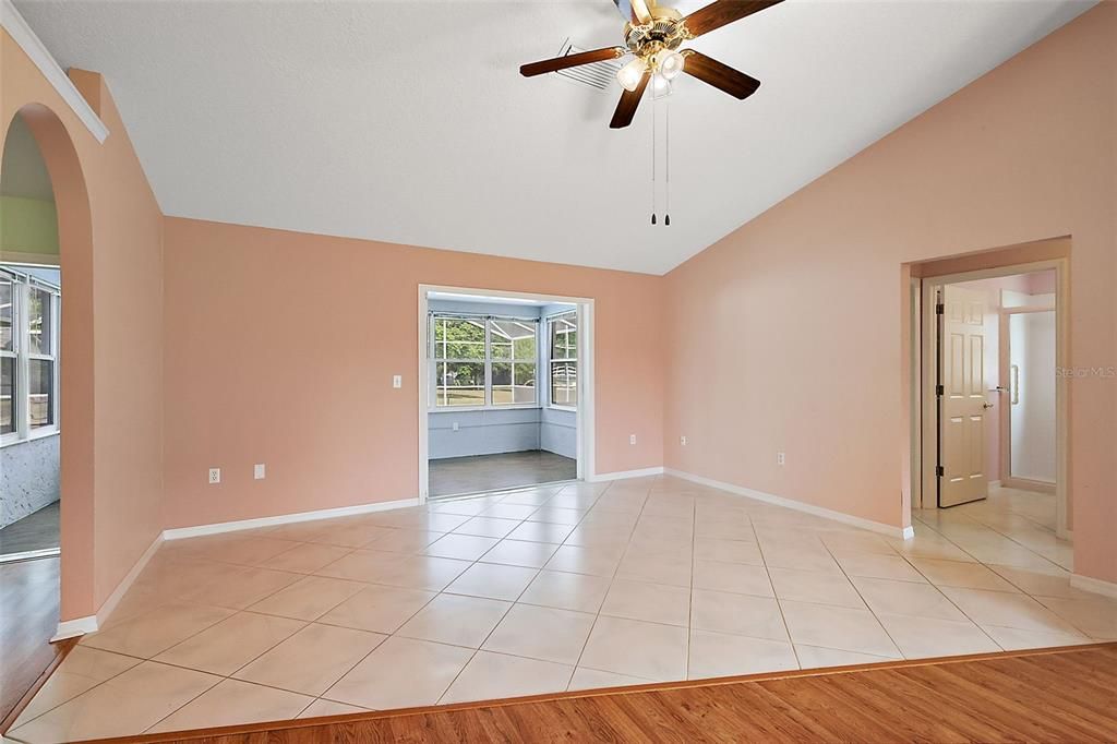 Dining room with tile floors; secondary bedrooms to the right, kitchen to the left