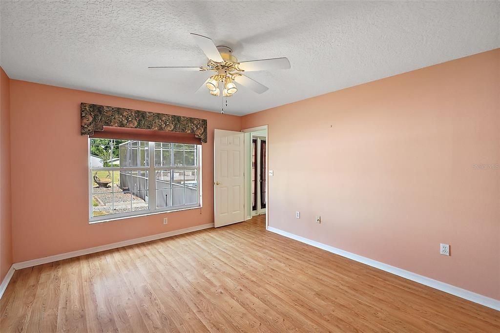 Primary bedroom has views of the pool