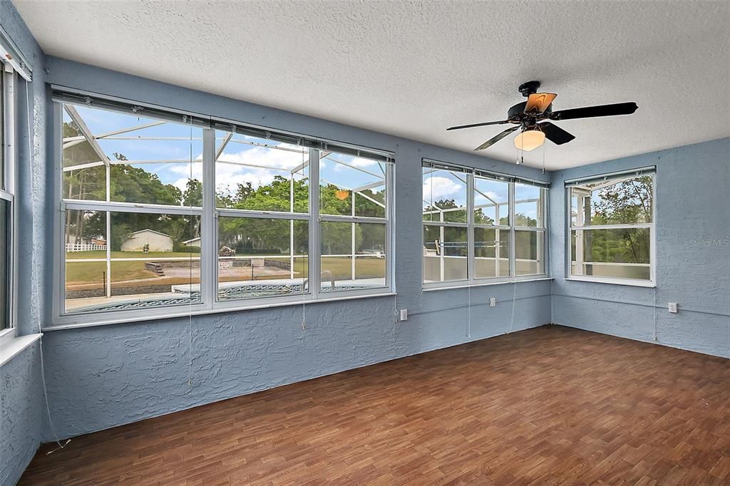 Fabulous enclosed Florida Room; great flex space... office, art studio, yoga space. With gorgeous views of the property.