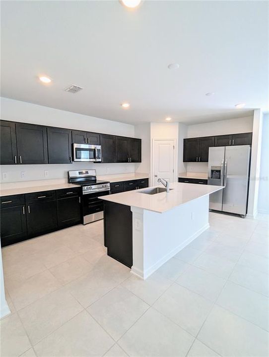 Kitchen with quartz counters and all appliances