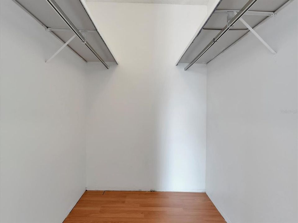 The walk-in closet in the master bedroom