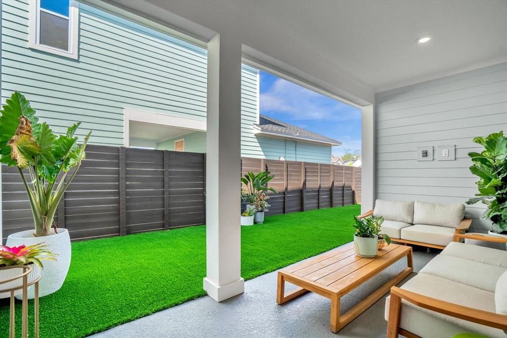 Back Patio w Fenced yard and year round turf.