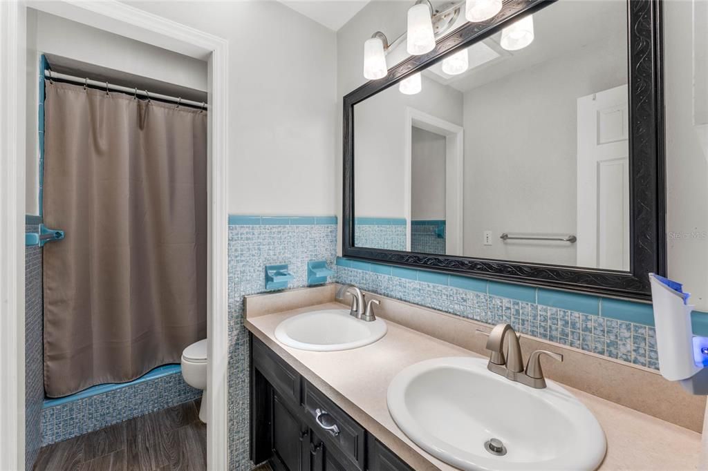 Primary Bedroom’s Bathroom with Shower and Dual Sinks