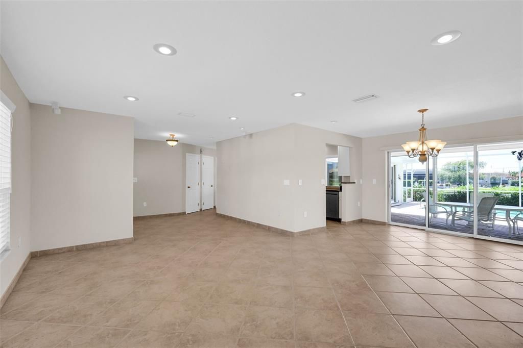 Large Living Room opens to Dining Room with pool & canal views