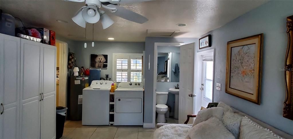 Family room with half bath and side door to back yard