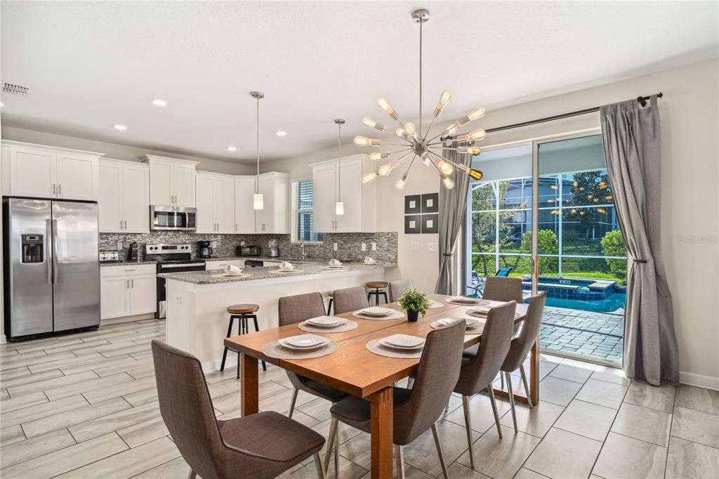 SLIDING GLASS DOORS LEADING TO ENTERTAINING POOL AREA