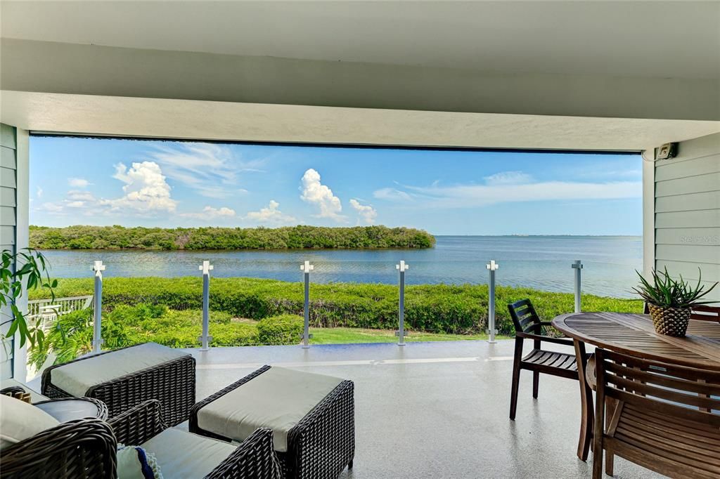 Steps from those vivid bay views, gather around the fireplace in the living room with soaring vaulted ceilings.