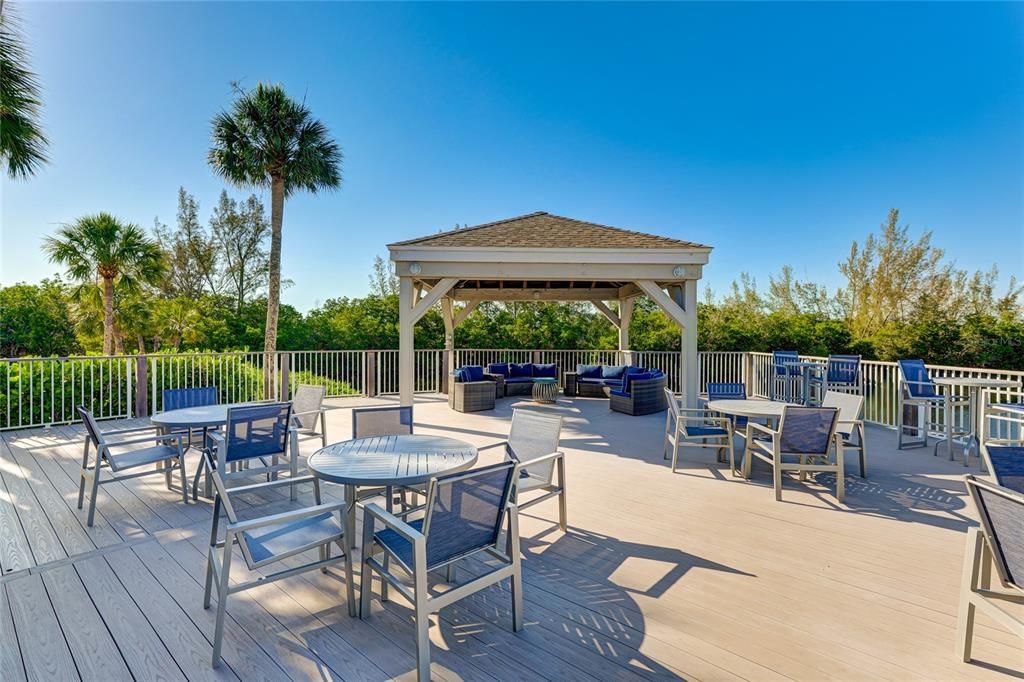 Party on the patio! The clubhouse deck offers plenty of seating and space for social gatherings.