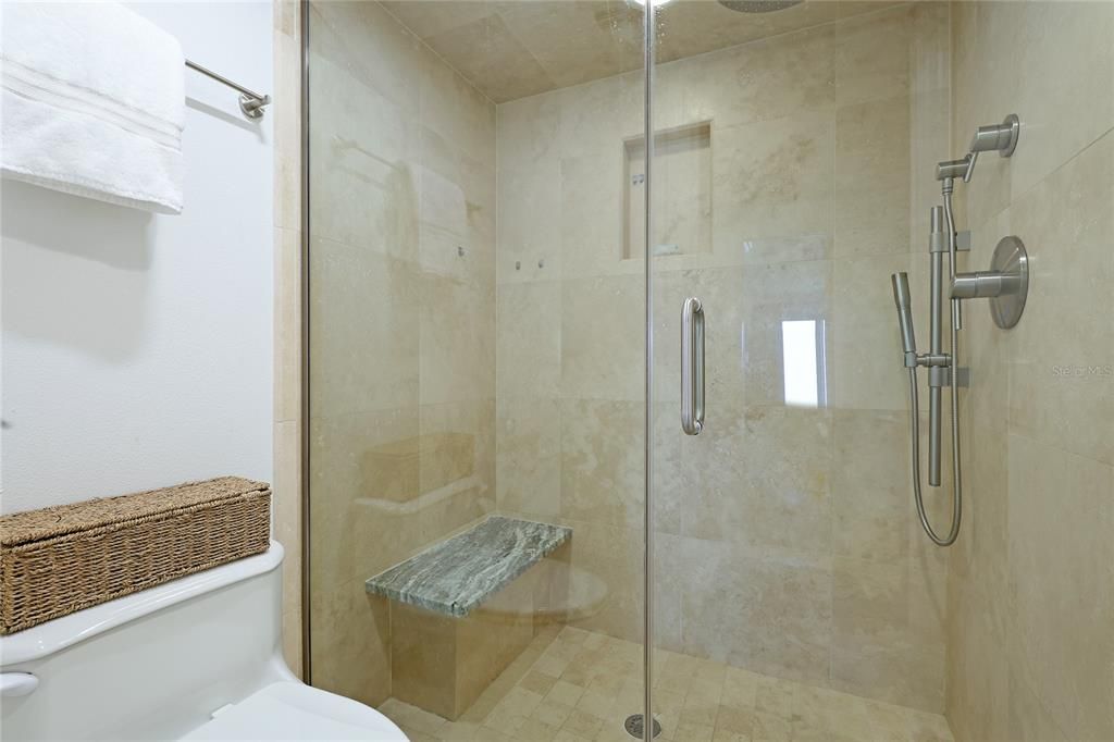 Take your time in the custom rain shower with Growe fixtures and built in bench.