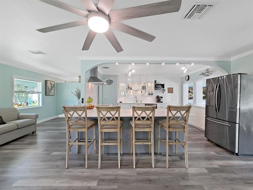 Spacious, updated Kitchen for gathering! Two-toned cabinetry, classic subway tile backsplash, and coastal tones.