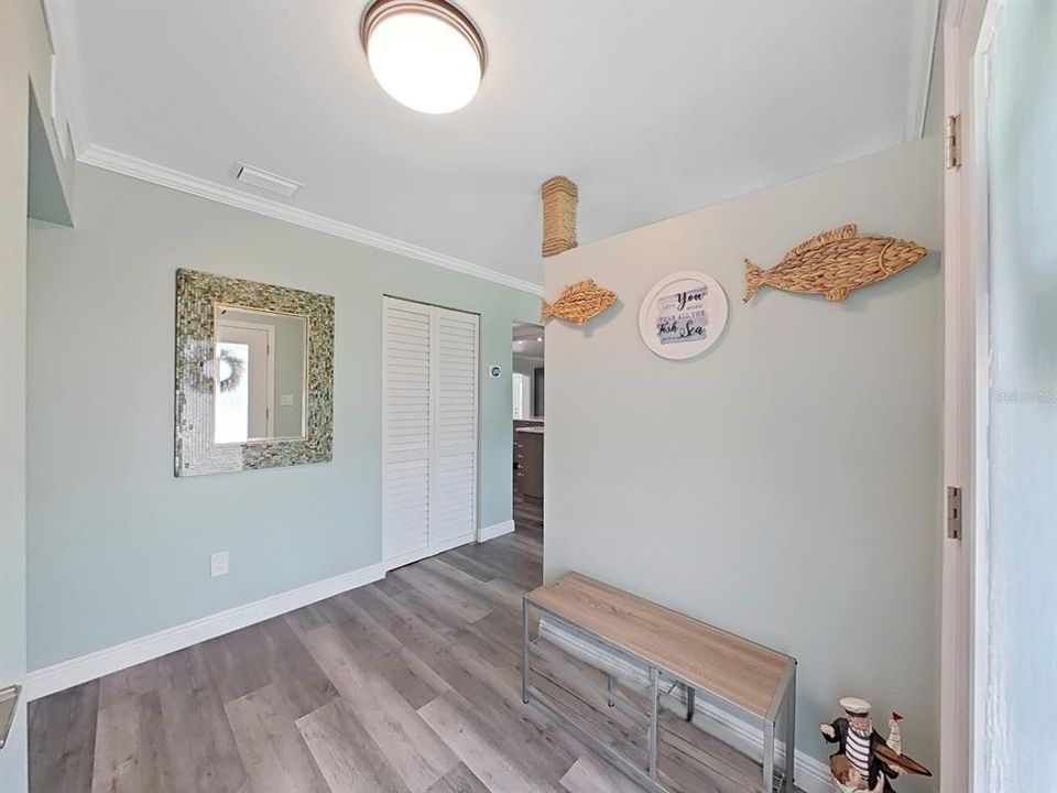 Foyer entry. So fresh and clean with a coastal feel! Walk-in closet on your left.