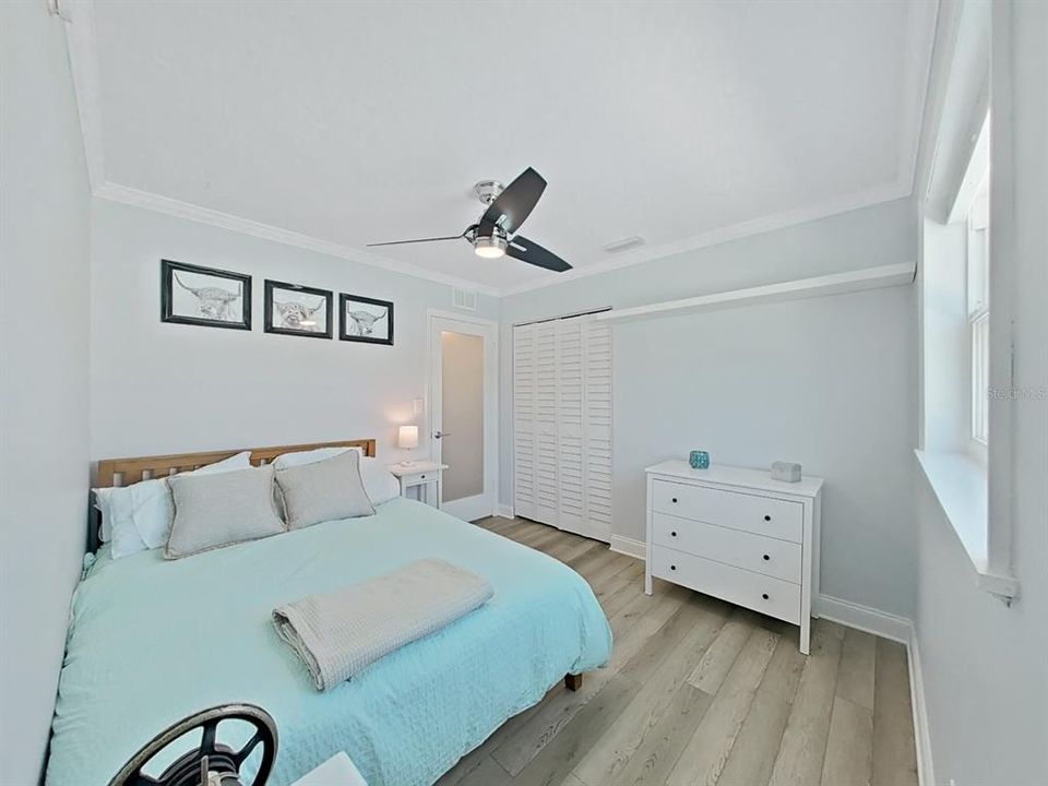 Bedroom 2. Frosted glass entry door elevates the look!