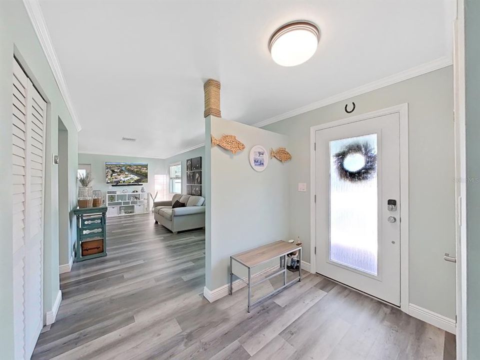 A foyer entry for greeting guests. New flooring throughout.. easy on your feet & easy to keep clean!