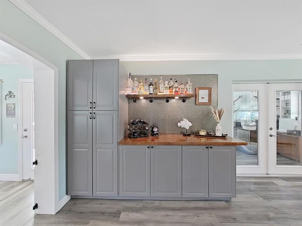 Custom Dry Bar with accent lighting, just off the Kitchen.