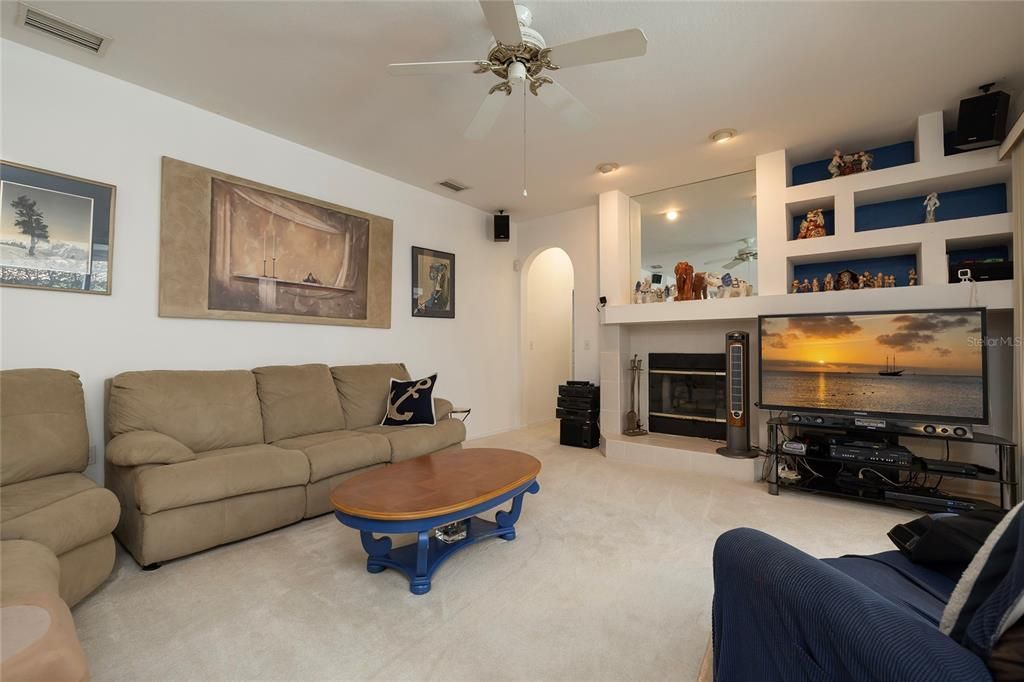 Family room with wood burning fireplace