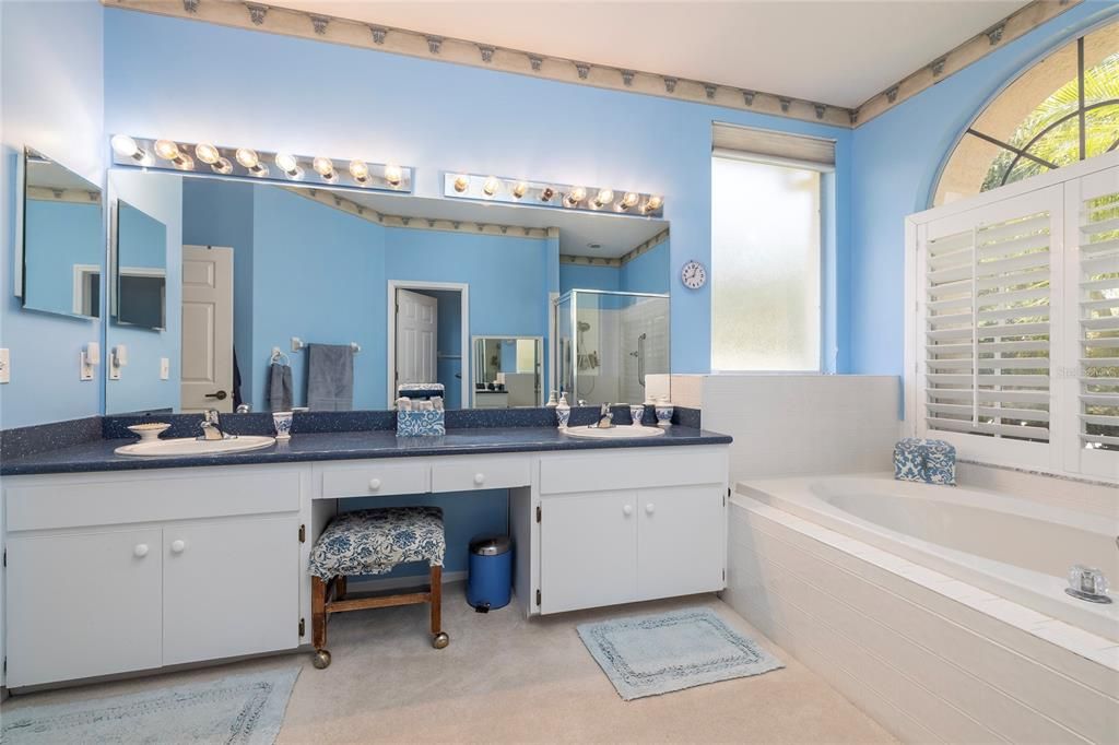 Primary bathroom with dual sinks and vanity