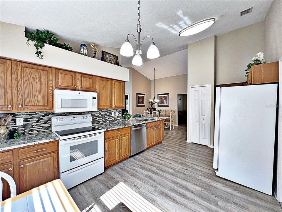 Another view of the kitchen that opens up into the living room and dining room