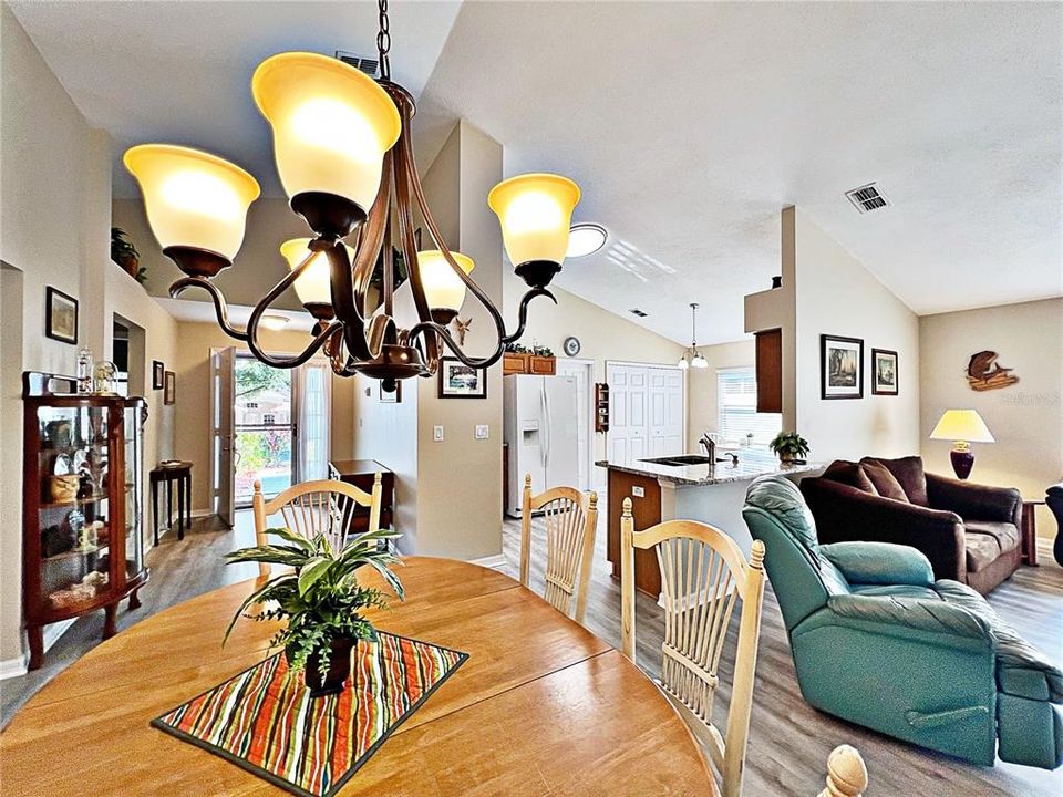 Additional view from dining room of front entry and kitchen